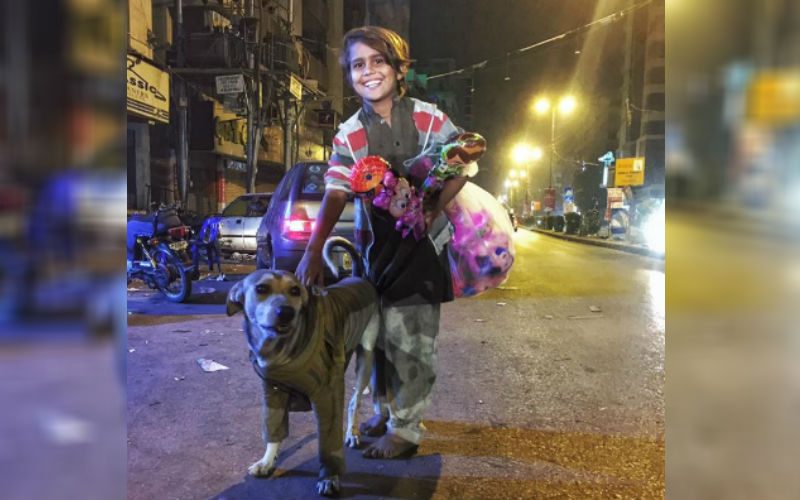 Young Boy Without Shoes Gave This Stray Dog A Sweater To Keep Warm